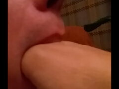 Slut gagging on own hand down his throat